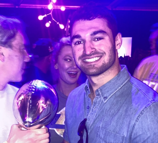 Athlete Marketing Expert Joe Sanfilippo holding the Lombardi Trophy at Super Bowl 56